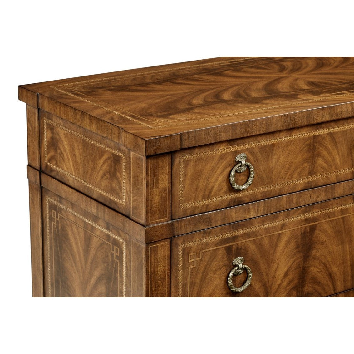 Close-up of walnut veneer dresser top edge featuring chevron inlay borders and scrollwork handles