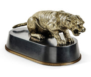 Front view antique bronze cougar crouched dynamically on brass-rimmed pedestal showing fangs