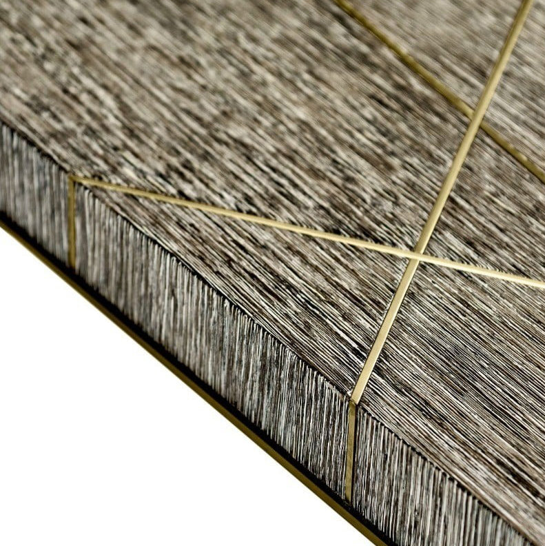 Corner detail showing layered wood grain texture and precise gold beveled edge