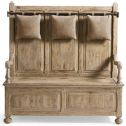 Rustic oak hall bench with three hanging beige velvet pillows and front storage doors