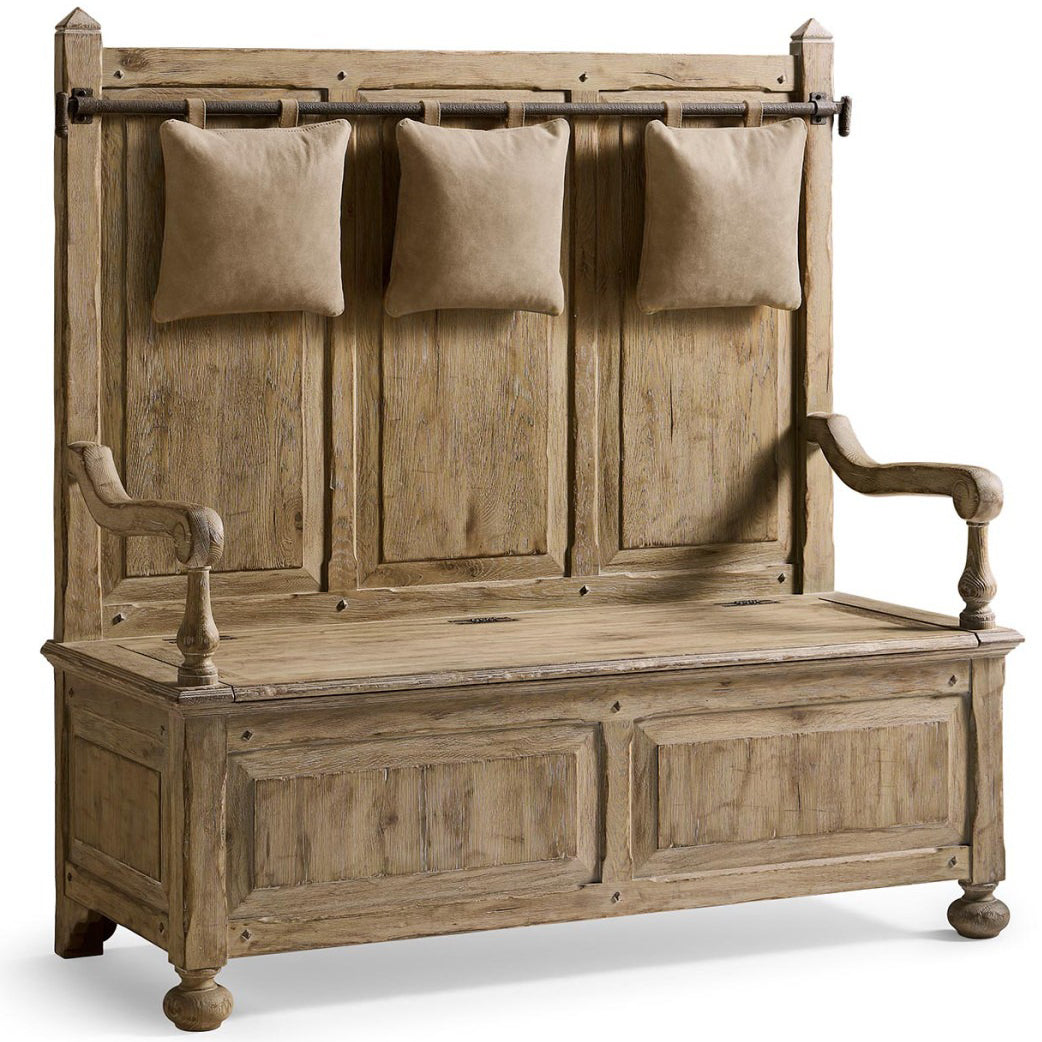 Front view of rustic oak hall bench with hinged lid, paneled doors, and hanging pillows