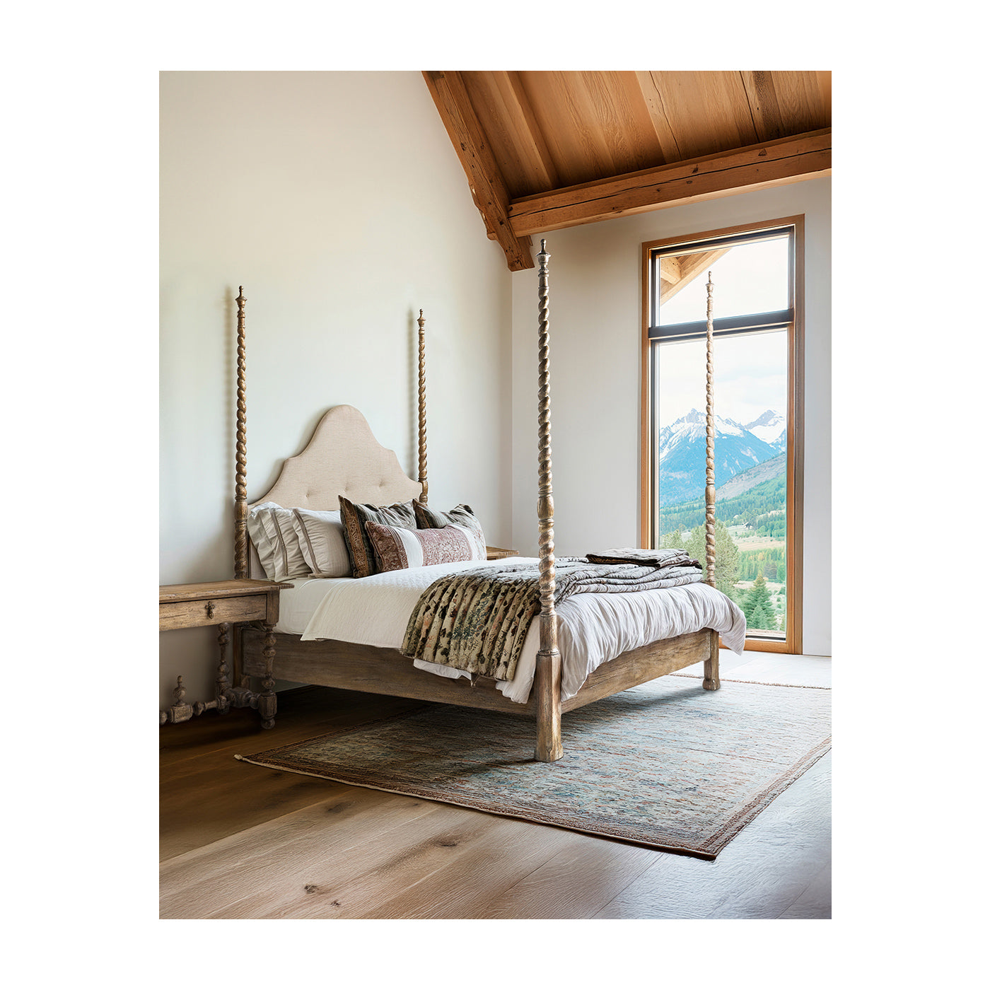 Mountain lodge bedroom styled with Jonathan Charles Caldera light Spain painted walnut four-poster bed and layered earthy bedding