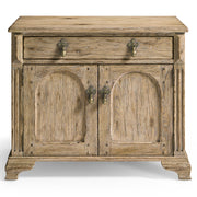 Jonathan Charles Sagehill rustic oak nightstand with arched panel doors, brass acorn pulls, and carved block feet
