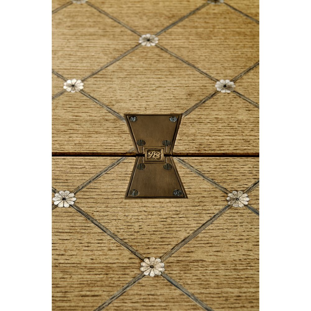 Detail shot of oak wood grain diamond grid inlay with white flower nodes and engraved JC butterfly latch