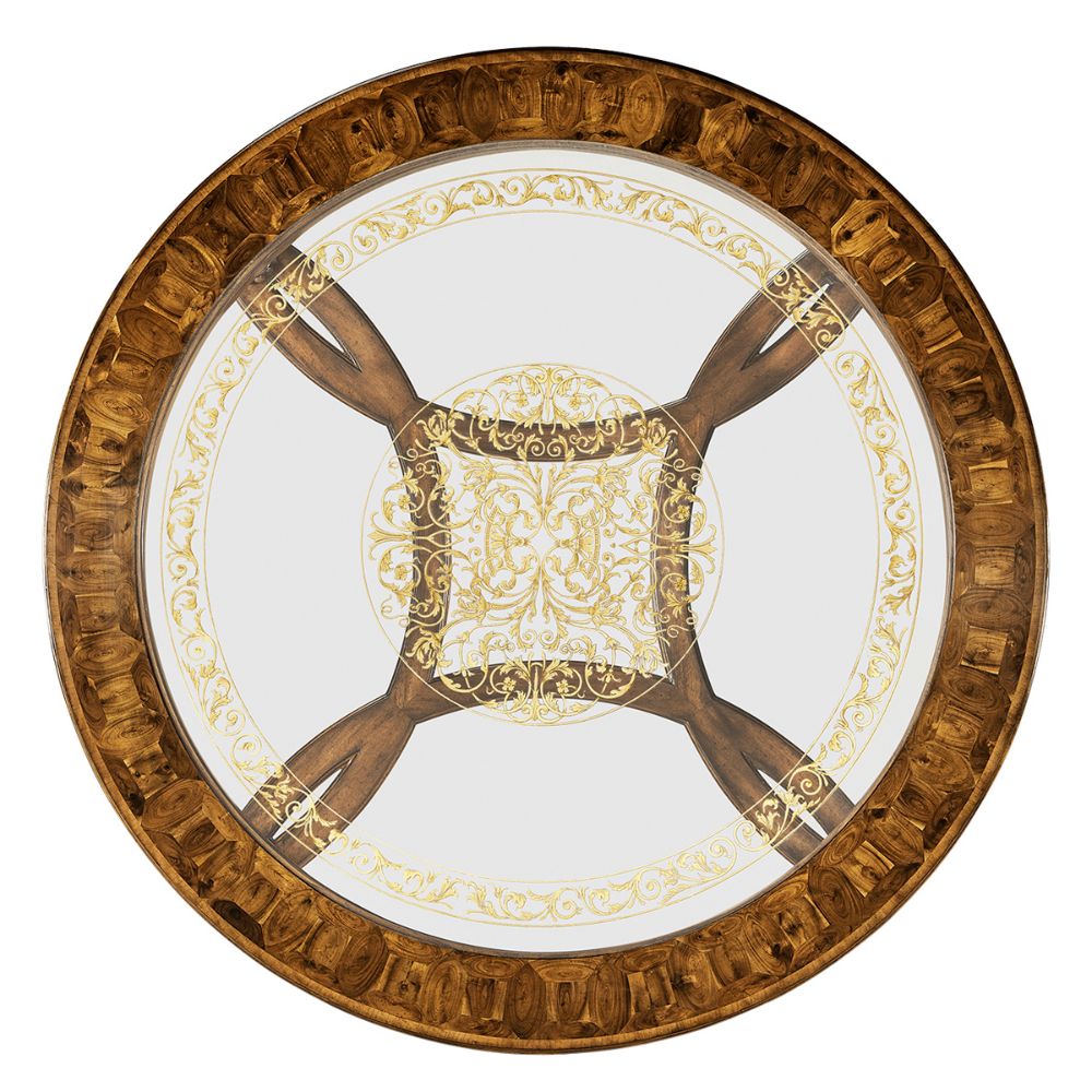 Top-down view of circular coffee table with gold baroque medallion and patchwork oyster veneer