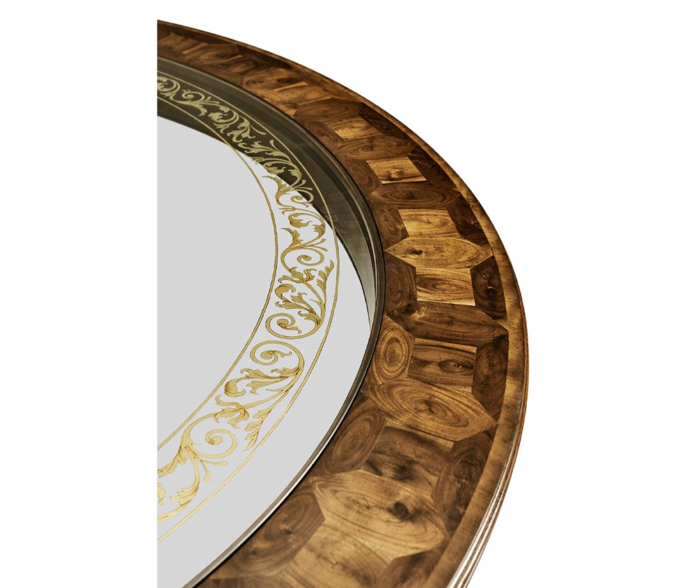 Close-up of oyster veneer hexagonal wood rim and gold scrollwork on glass edge