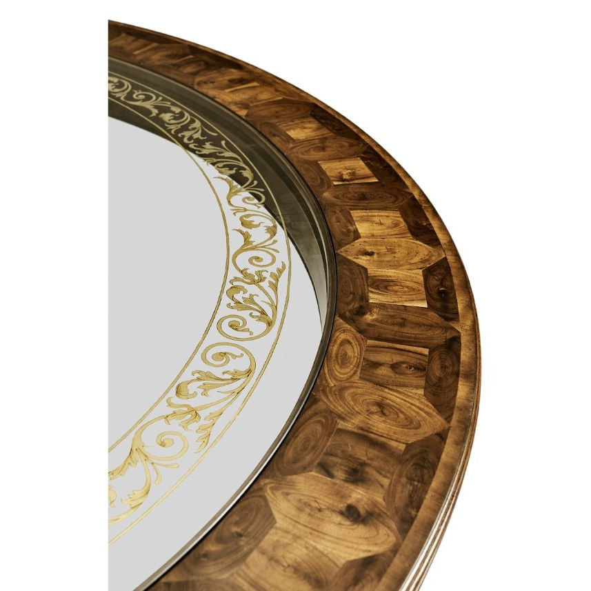 Close-up of oyster veneer hexagonal wood rim and gold scrollwork on glass edge