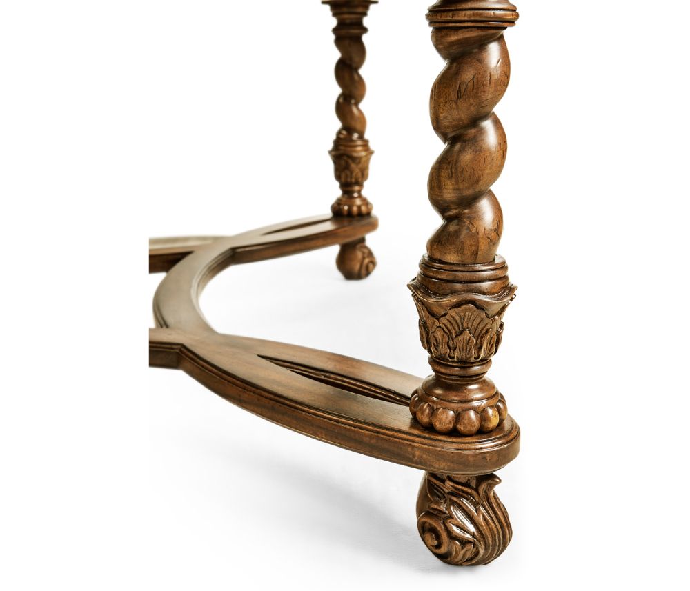 Turned wooden leg with twisted rope carving, acanthus capital, and claw-and-ball foot