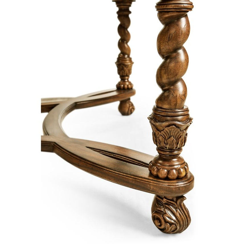 Turned wooden leg with twisted rope carving, acanthus capital, and claw-and-ball foot