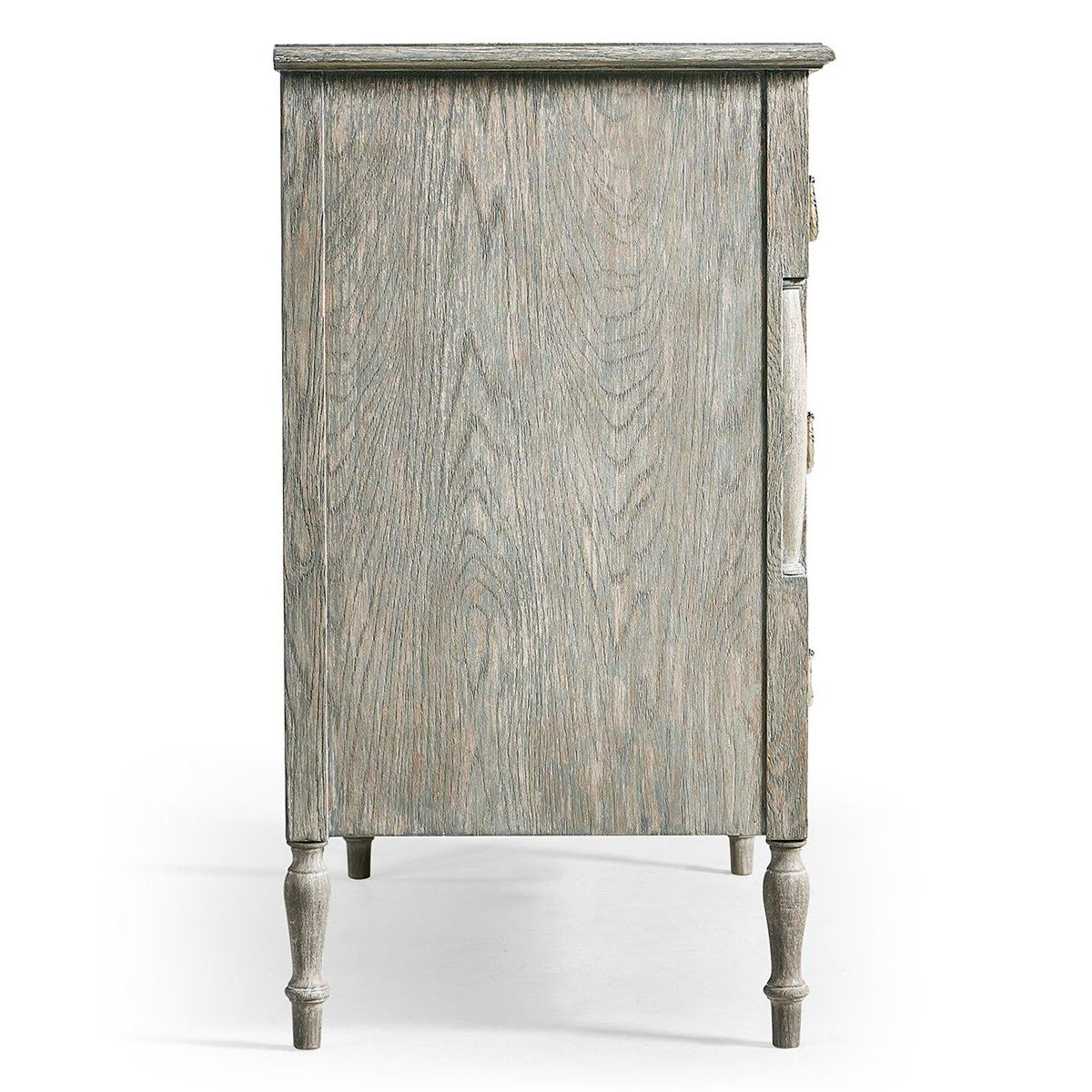 Side profile of Jonathan Charles Morningside chest displaying turned legs and recessed handle slot on distressed gray panel