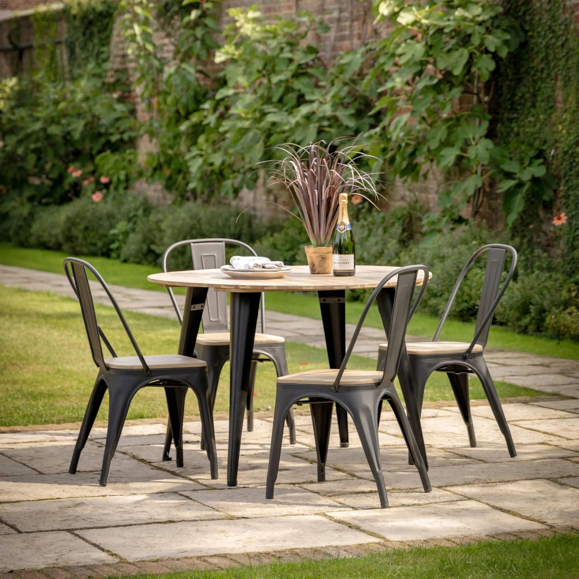 Monzaro Round Outdoor Dining Table   Nicholas John Interiors