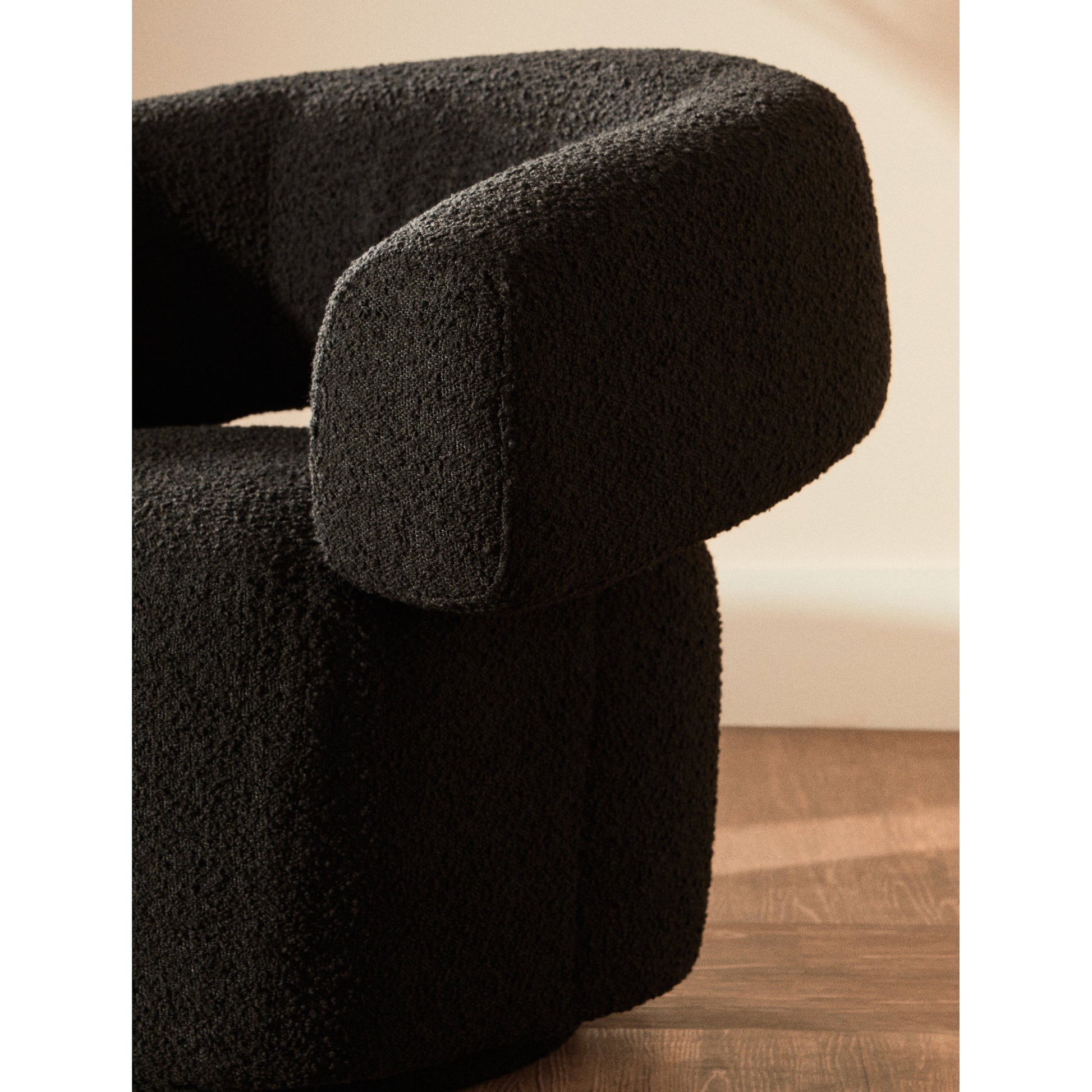 Olivra Black Boucle Curved Revolving Armchair  Nicholas John Interiors