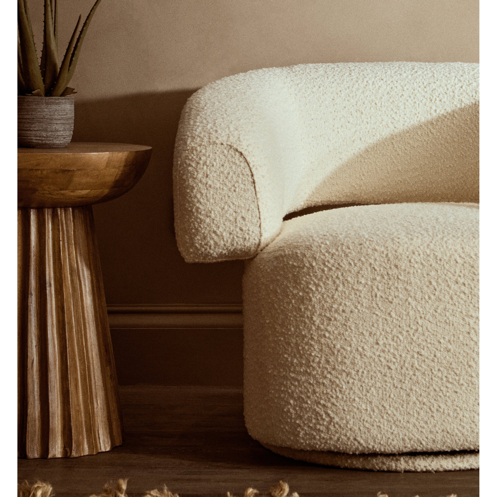 Olivra Ivory Boucle Curved Revolving Armchair  Nicholas John Interiors