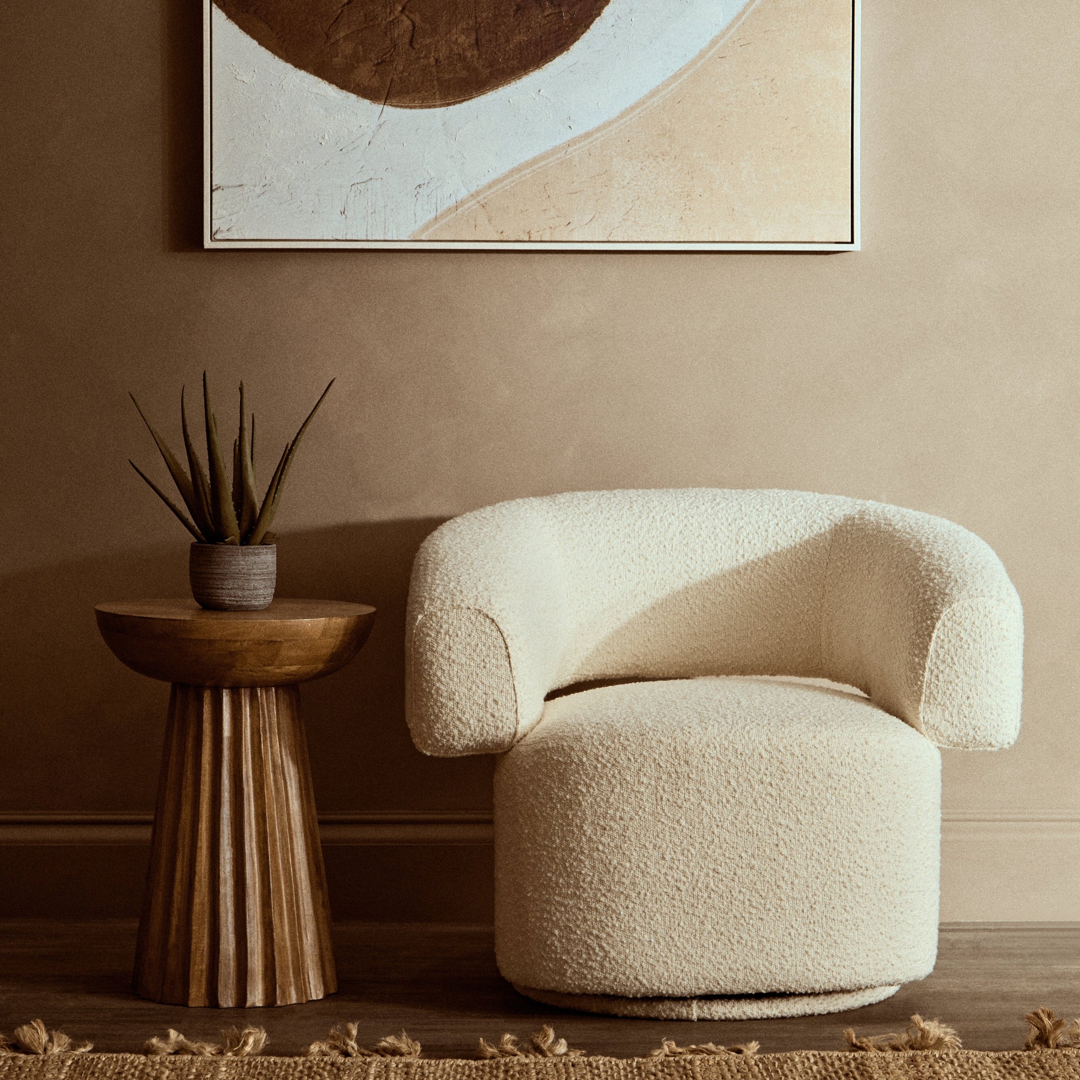 Olivra Ivory Boucle Curved Revolving Armchair  Nicholas John Interiors