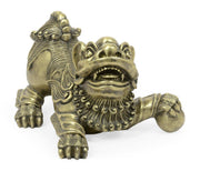 Front antique brass Foo Dog sculpture with open mouth, spiral beard, and spherical ball grip