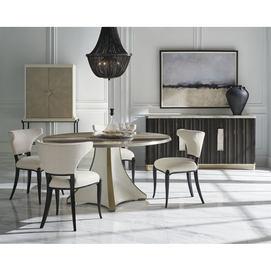 Caracole Crushing It Sideboard in dining room with gold pulls and stone top