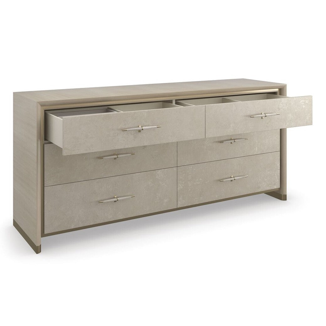 Caracole Hang Up six-drawer dresser with open drawers showing smooth interior, Winter Frost metallic leaf finish, and Dry Martini wood frame