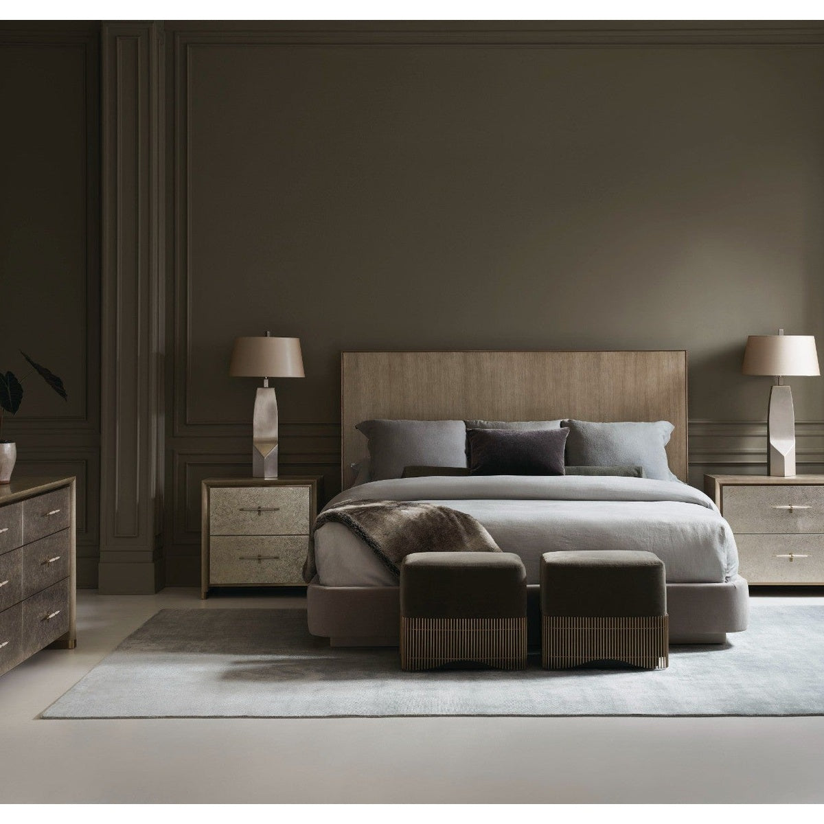 Coordinated bedroom set featuring Caracole Hang Up six-drawer dresser with matching nightstands against dark taupe walls