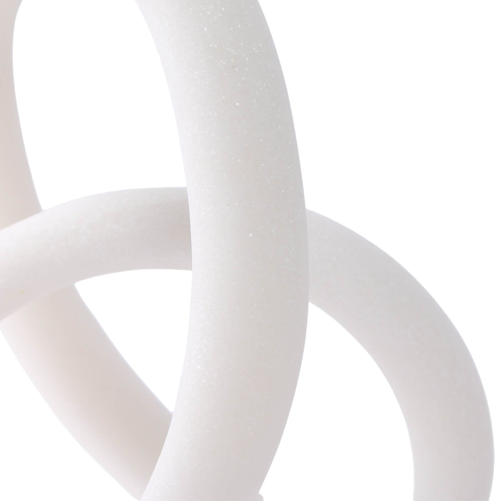 Side angle detail of layered white resin loop intersection revealing material thickness and texture