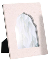 Single beige sandstone frame displaying abstract teal design