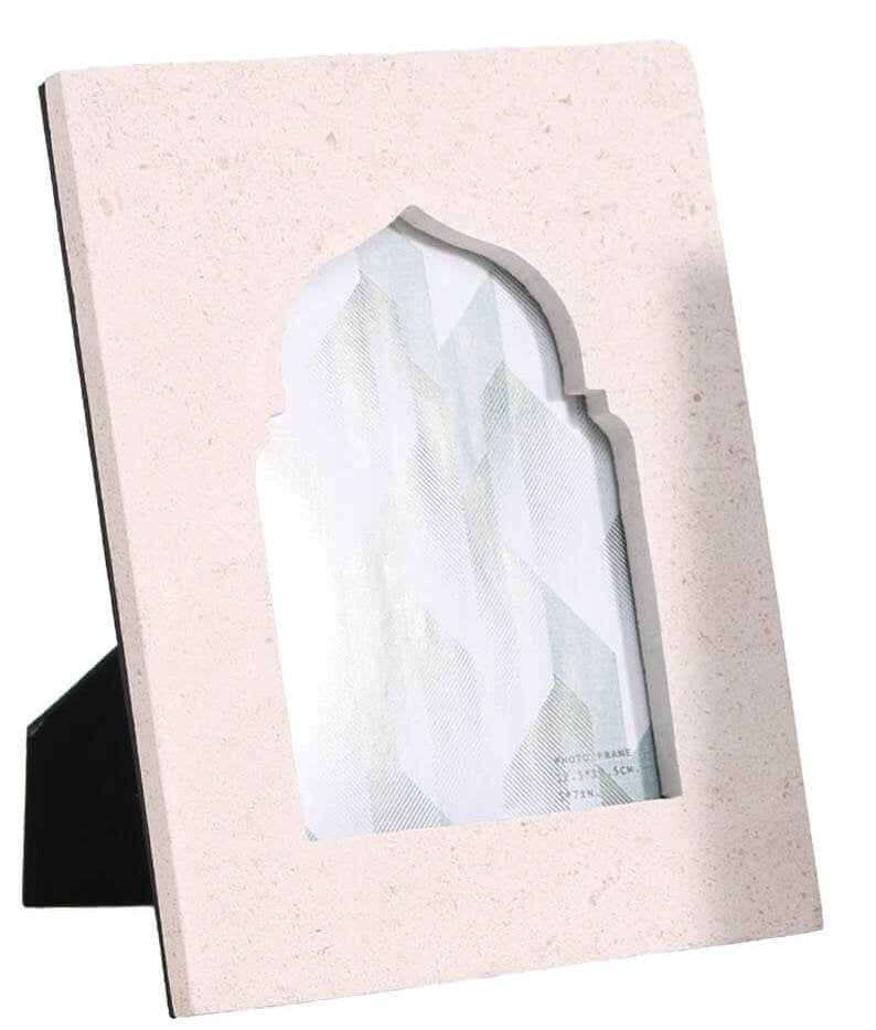 Single beige sandstone frame displaying abstract teal design