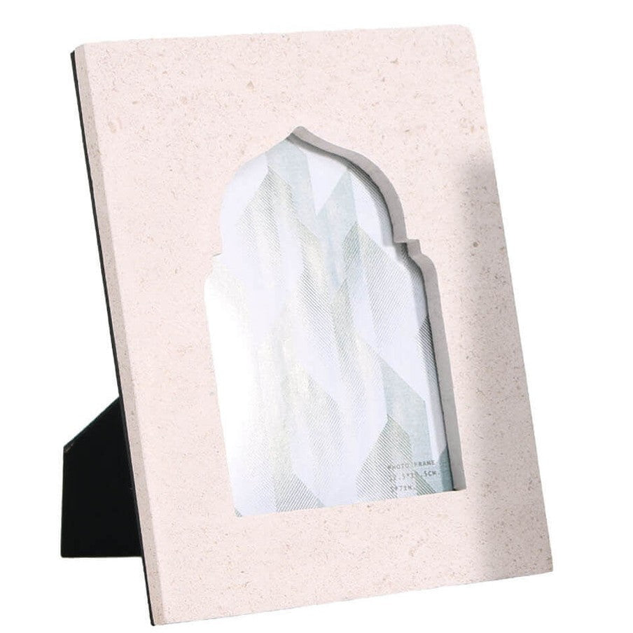 Single beige sandstone frame displaying abstract teal design