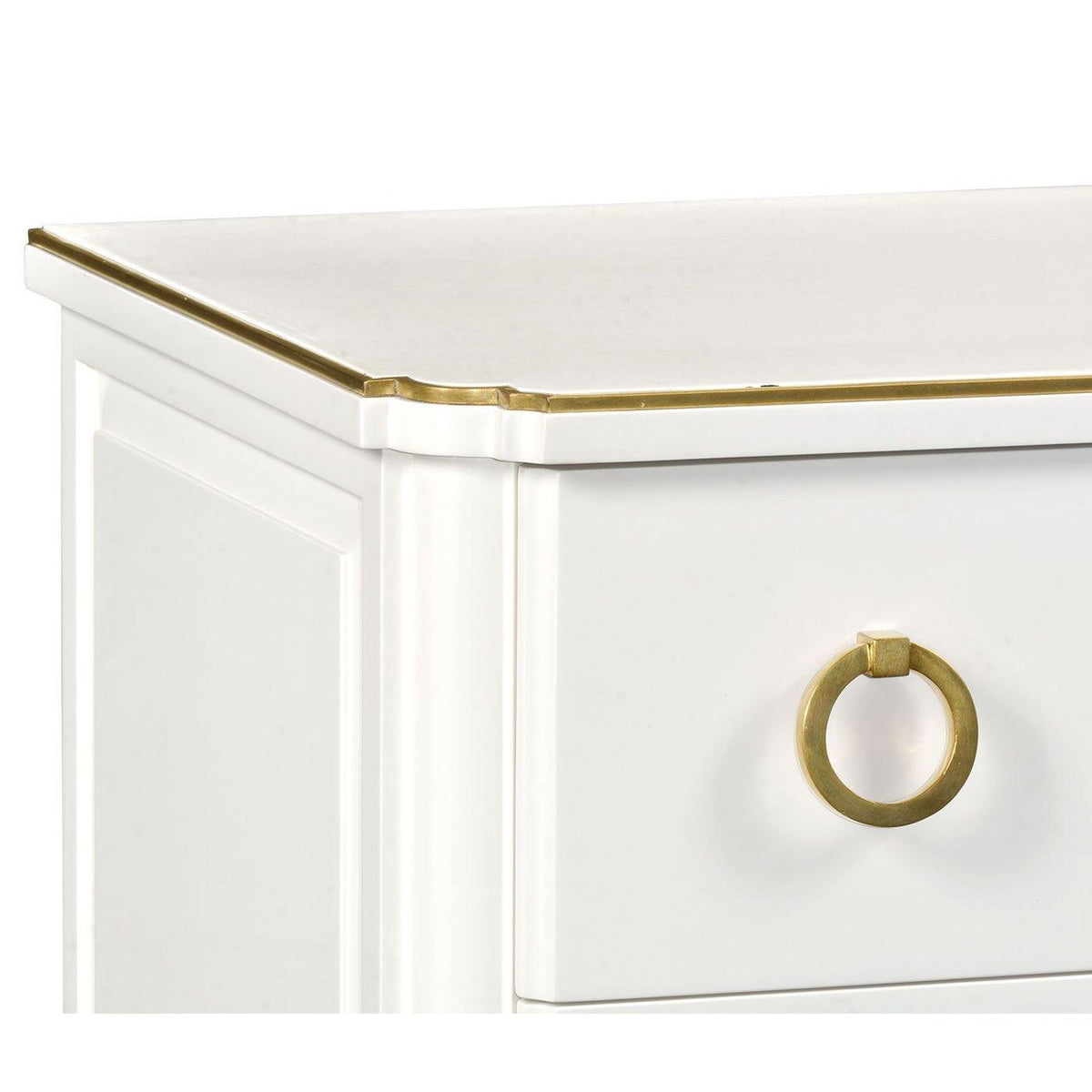 Ivory painted chest of drawers corner detail with scalloped brass trim and round ring pull handle
