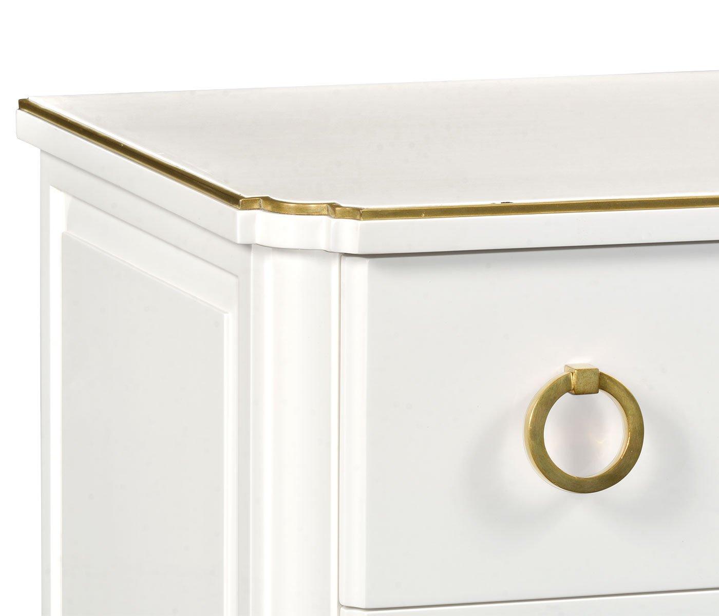 Ivory painted chest of drawers corner detail with scalloped brass trim and round ring pull handle