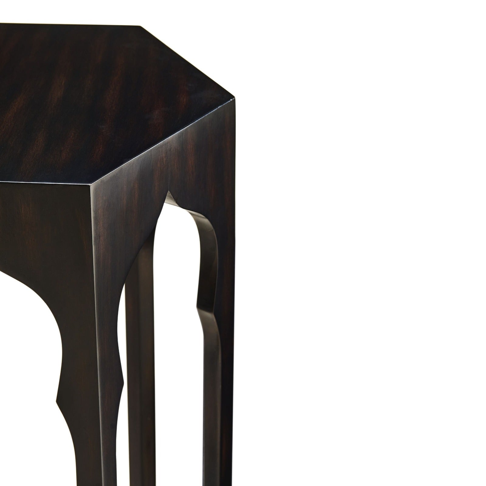 Corner detail of ebony hexagon lamp table showing edge joinery and curved arch leg cutout