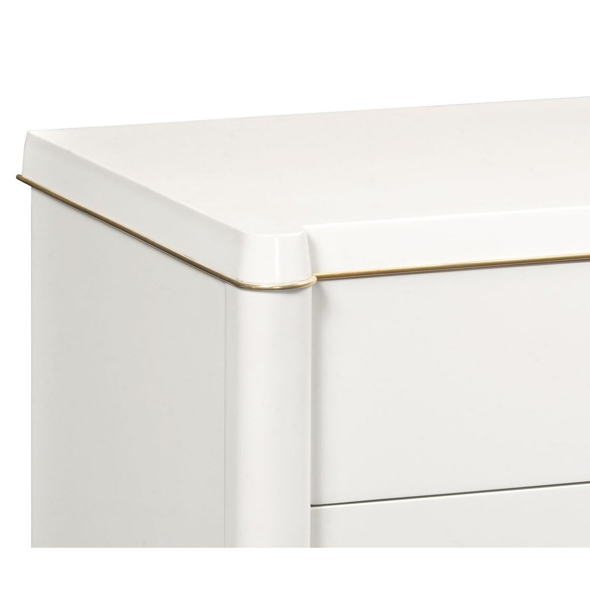 Detail of rounded top edge and gold trim on Jonathan Charles ivory painted chest of drawers