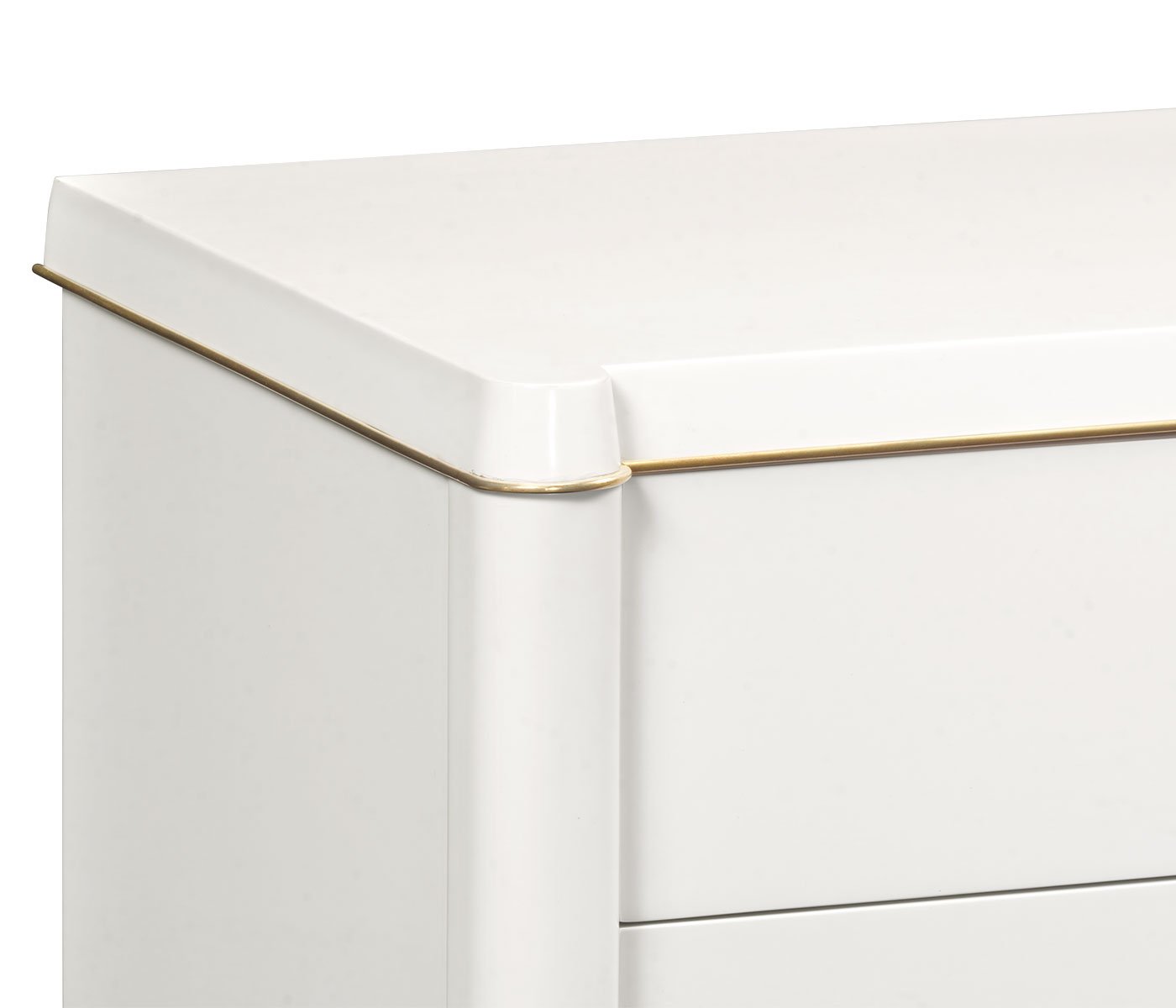 Detail of rounded top edge and gold trim on Jonathan Charles ivory painted chest of drawers